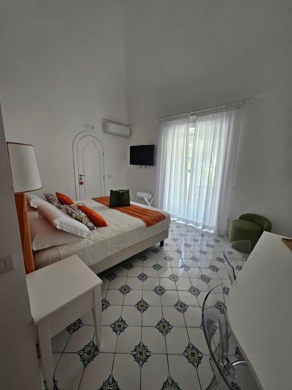 Televízia a/alebo spoločenská miestnosť v ubytovaní Casa Mandara B&B