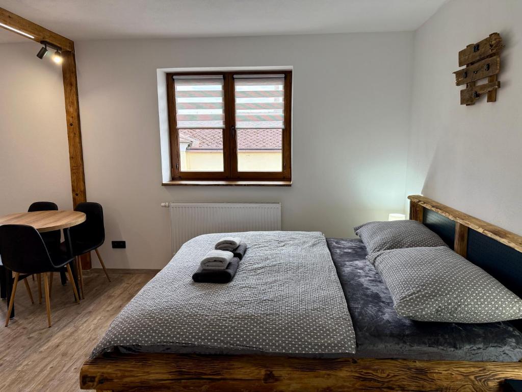 Postel nebo postele na pokoji v ubytování Penzion U Grobiana