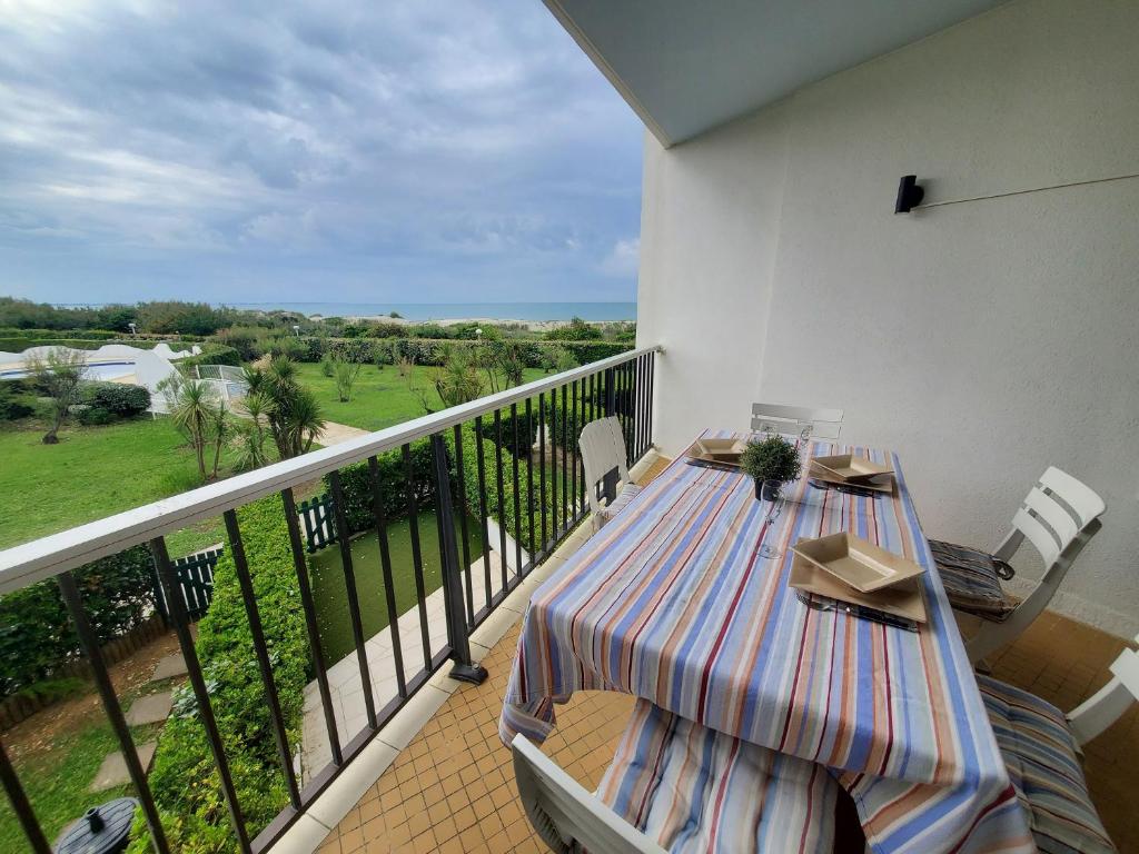 Balkón nebo terasa v ubytování DUNES 1D4 VUE MER WIFI CLIMATISATION PISCINE et son PK
