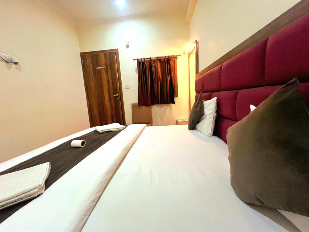 Postel nebo postele na pokoji v ubytování Rahgir Tales Hostel "Taj View"