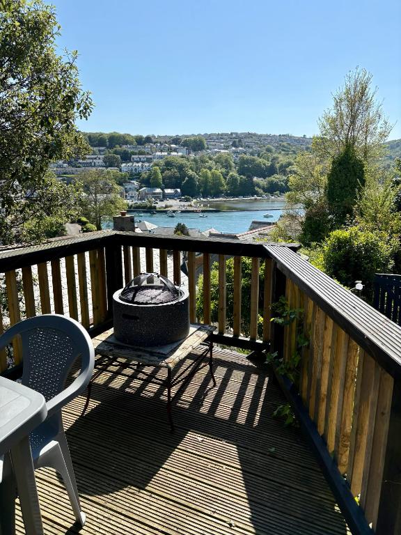 a grill on a deck with a view of a river at The Fishermans Daughters in Looe