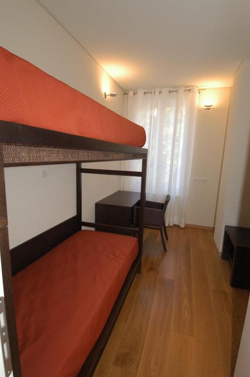 Łóżko lub łóżka w pokoju w obiekcie Residence Il Fortino