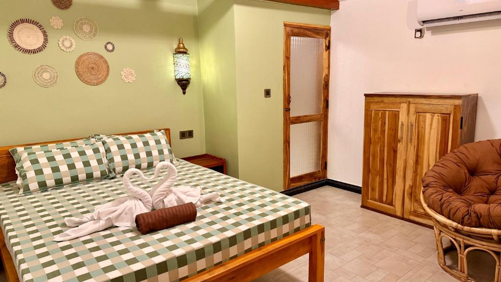 Postel nebo postele na pokoji v ubytování Arcadia villas Arugambay