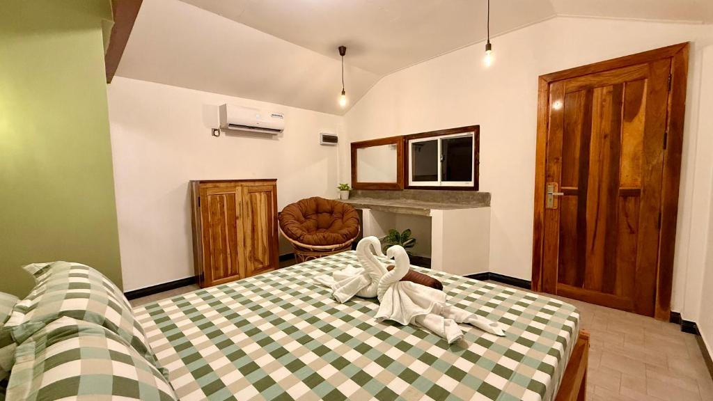 Postel nebo postele na pokoji v ubytování Arcadia villas Arugambay