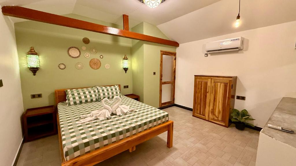 Postel nebo postele na pokoji v ubytování Arcadia villas Arugambay