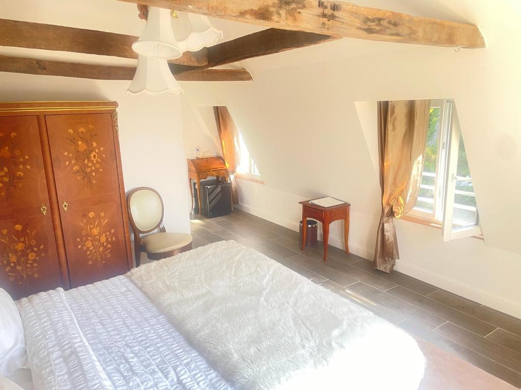 Postel nebo postele na pokoji v ubytování Hôtel Victor Hugo