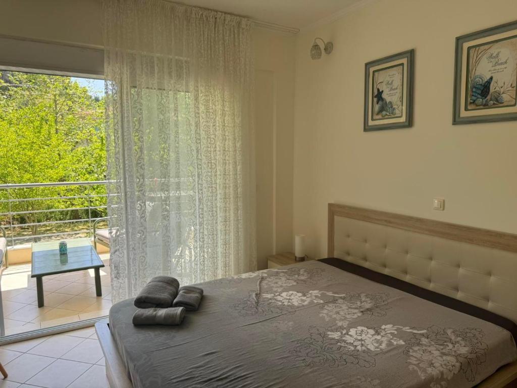 Postel nebo postele na pokoji v ubytování Raya Apartments Siviri Garden