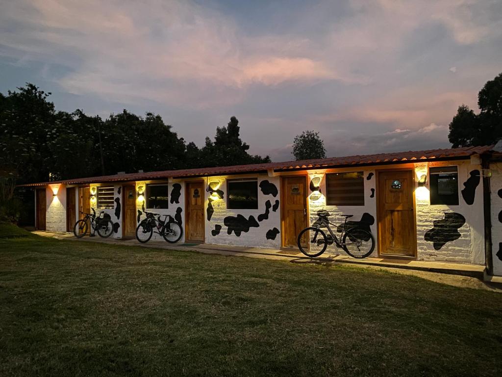 a house with bikes parked in front of it at Finca Castillo de Altura in San Juan