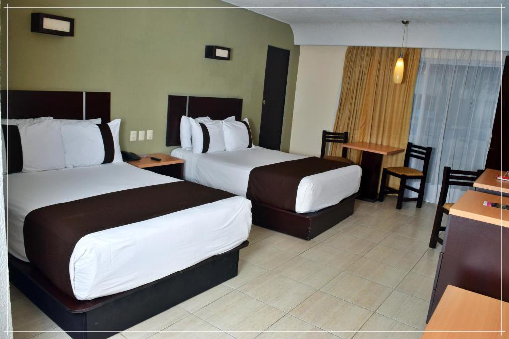 Postel nebo postele na pokoji v ubytování Hotel Real de Minas Tradicional