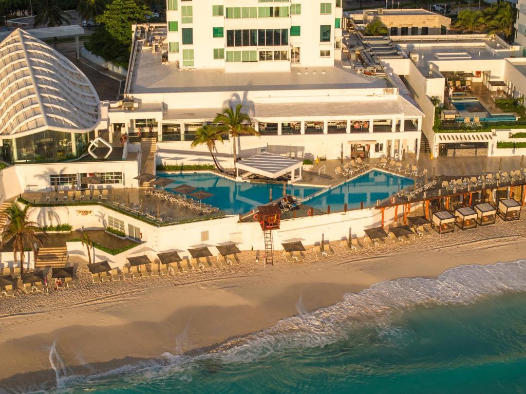 an aerial view of a hotel and the beach at Paradisiaca Suite Cancun - BEACH CONDO - 4PX in Cancún