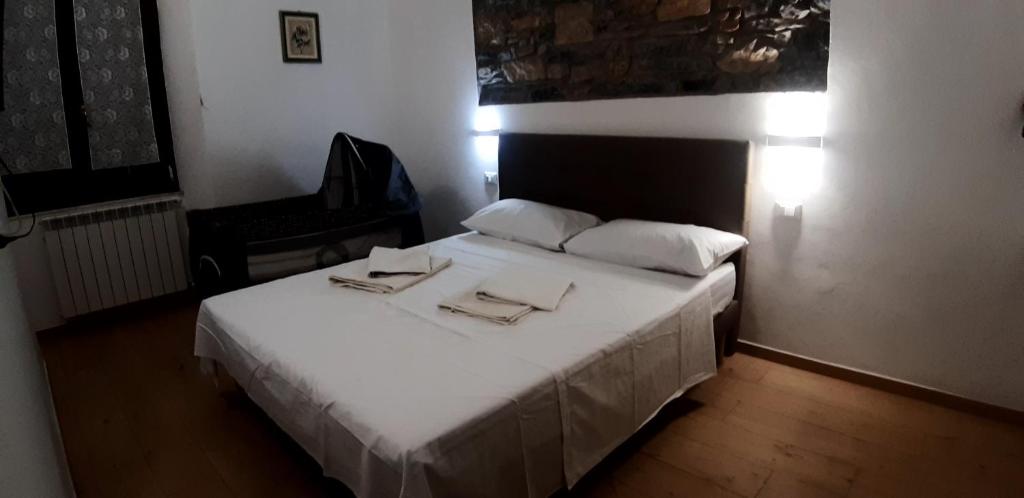 Posteľ alebo postele v izbe v ubytovaní Chez Sabrine - La Spezia Via Fiume 112