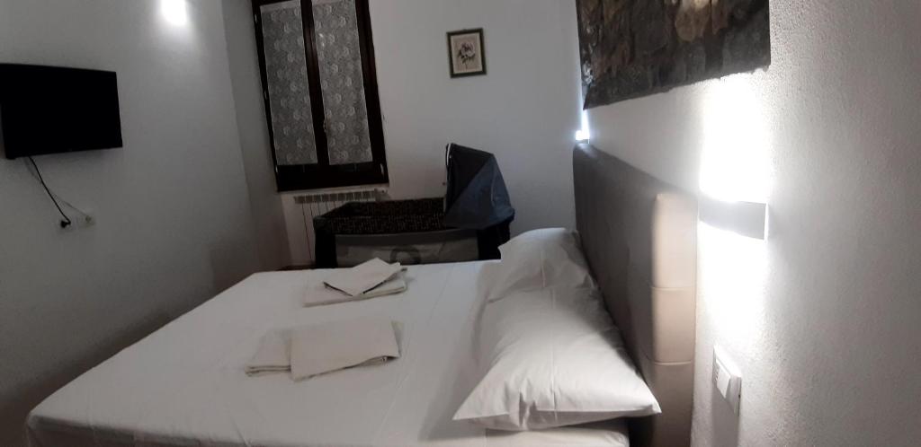 Posteľ alebo postele v izbe v ubytovaní Chez Sabrine - La Spezia Via Fiume 112