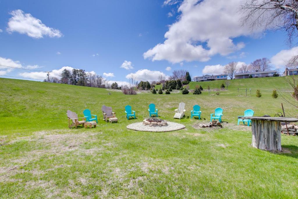 a group of chairs and a fire pit in a field at Algoma Retreat Near Beach, Game Room, Yard in Algoma