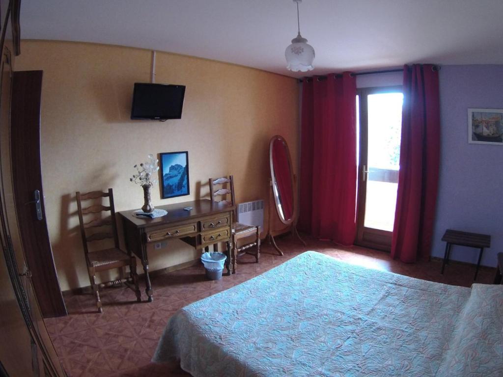 Postel nebo postele na pokoji v ubytování Boustigue Hotel