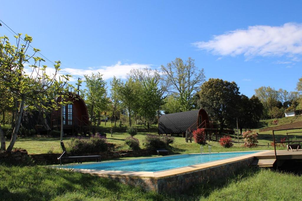 a swimming pool in a yard with a yurt at Quinta da Devesa -B2 in Vinhais