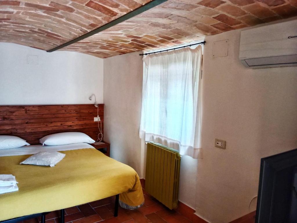 Postel nebo postele na pokoji v ubytování Casa Dona' Penne