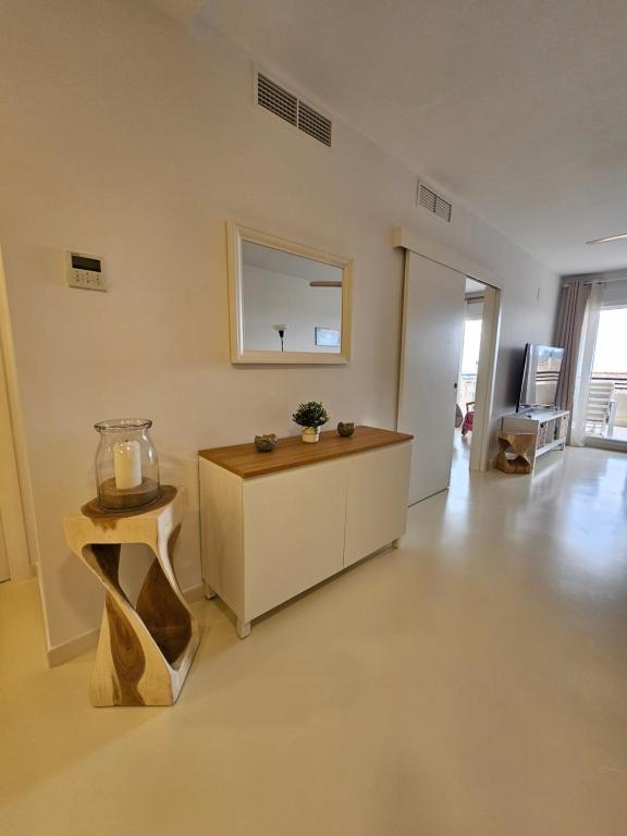 a large living room with a table and a mirror at Modern Appartement Alenda Golf in Monforte del Cid