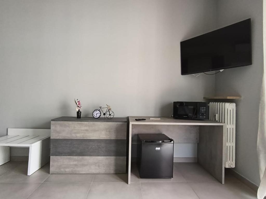 TV a/nebo společenská místnost v ubytování Cuneo Bedroom