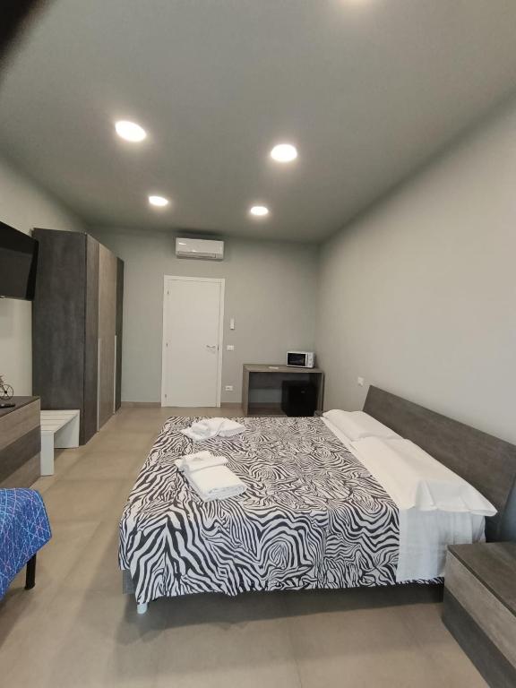 Postel nebo postele na pokoji v ubytování Cuneo Bedroom