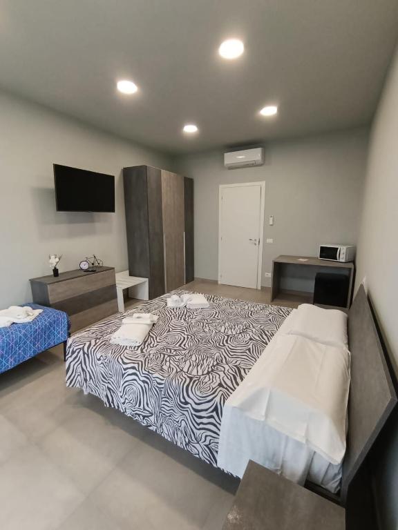 Postel nebo postele na pokoji v ubytování Cuneo Bedroom