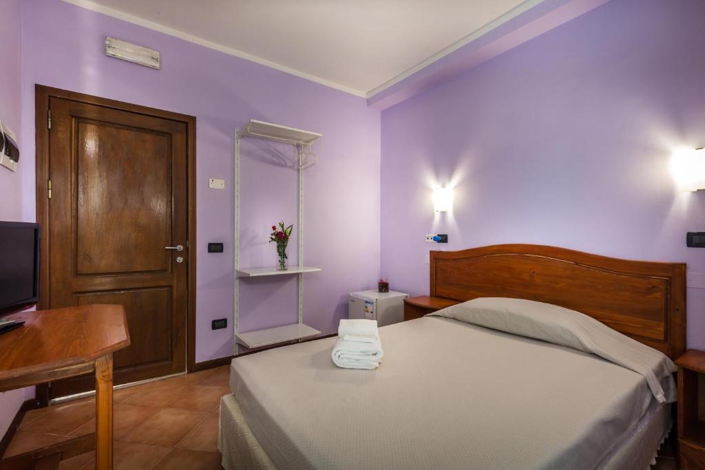 Postel nebo postele na pokoji v ubytování Hotel Real