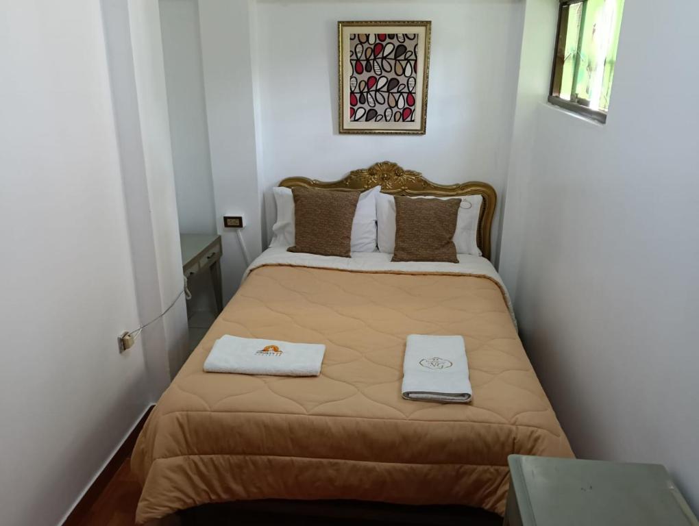 Postel nebo postele na pokoji v ubytování Andean Hostel
