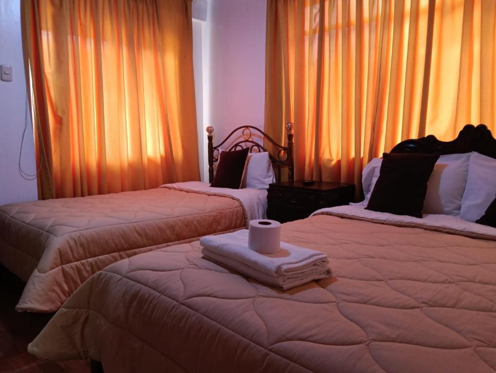 Postel nebo postele na pokoji v ubytování Andean Hostel