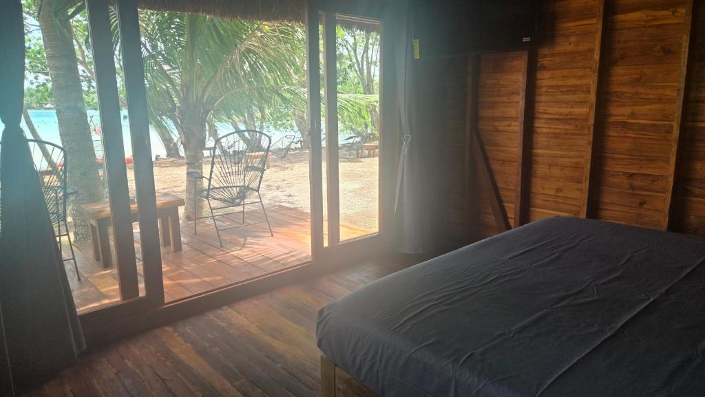 Postel nebo postele na pokoji v ubytování Playa Laguna Bacalar Beach Front