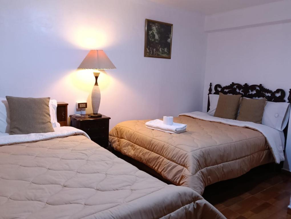 Postel nebo postele na pokoji v ubytování Andean Hostel