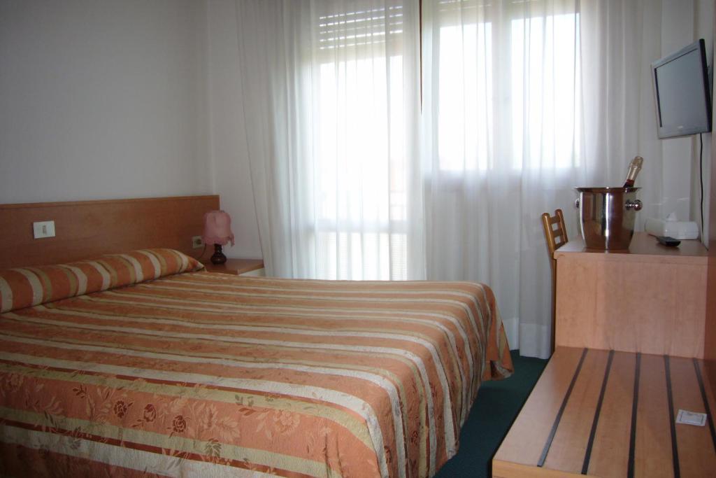 Postel nebo postele na pokoji v ubytování Hotel Kristall