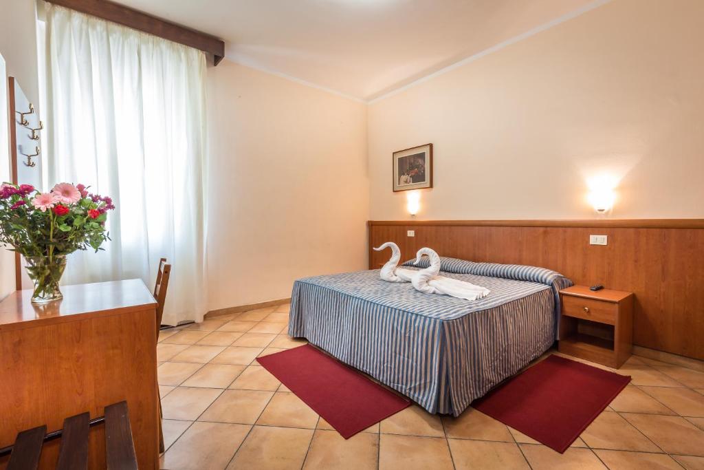 Postel nebo postele na pokoji v ubytování Hotel Real