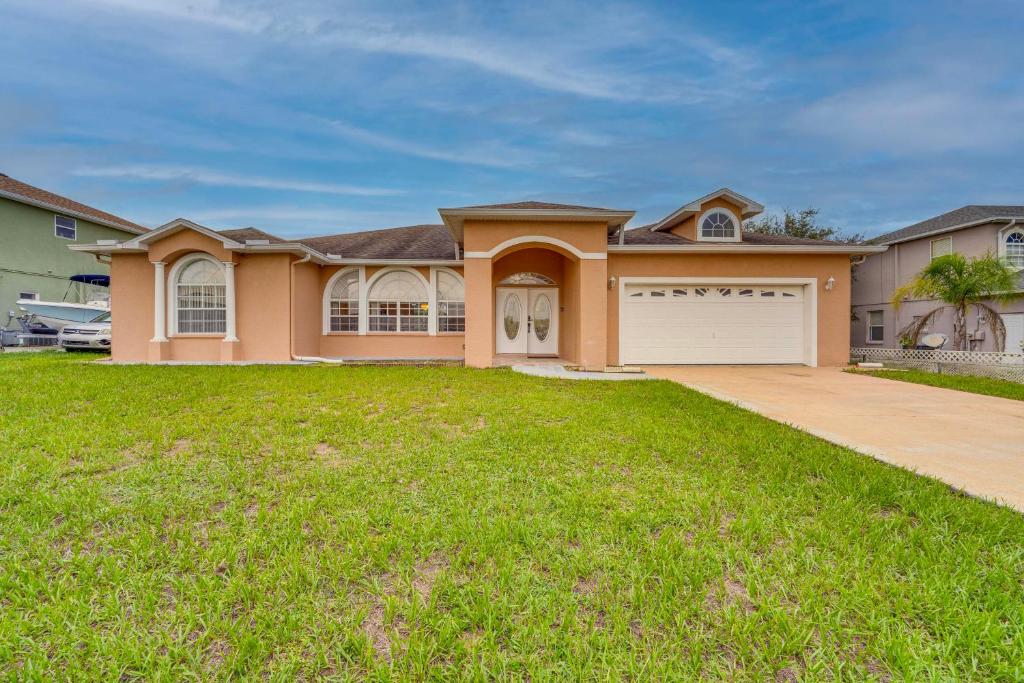 a large house with a large yard at Private Pool and Lanai Family Home in Haines City! in Haines City