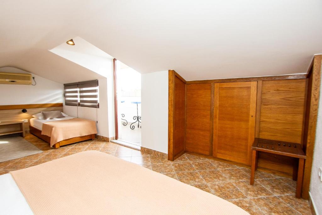 Postel nebo postele na pokoji v ubytování Guest House Jedro