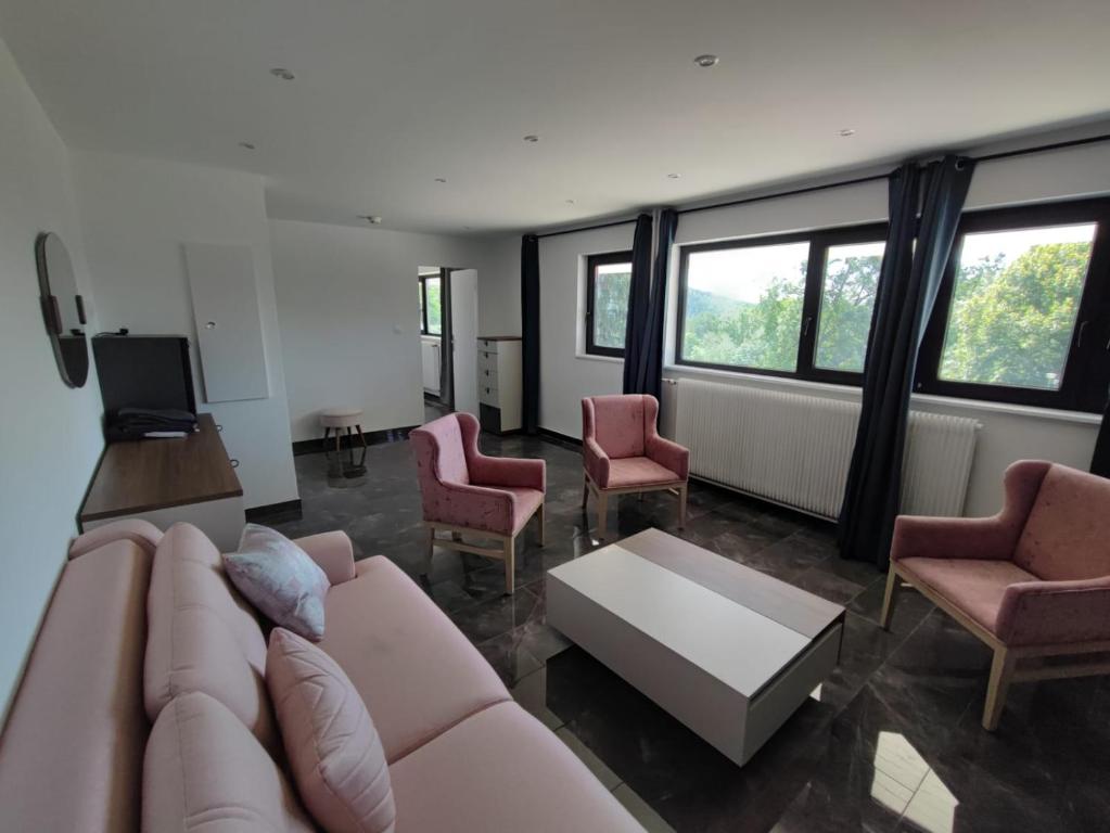 Posezení v ubytování Hotel Parc Les Cigognes