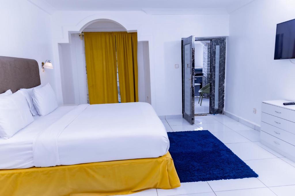 Postel nebo postele na pokoji v ubytování Pinorich Hotel
