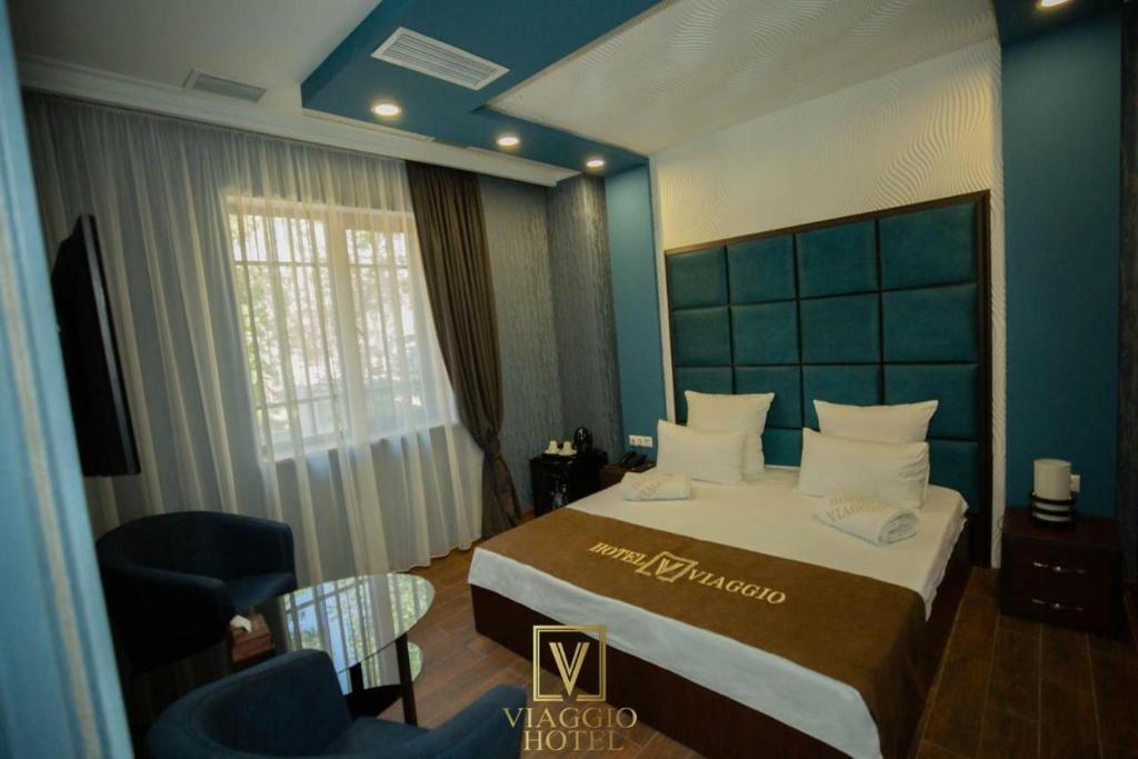 Postel nebo postele na pokoji v ubytování WIAGGIO Hotel