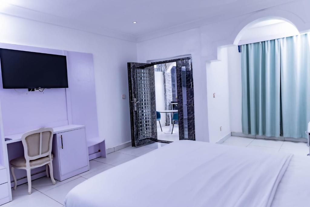Postel nebo postele na pokoji v ubytování Pinorich Hotel