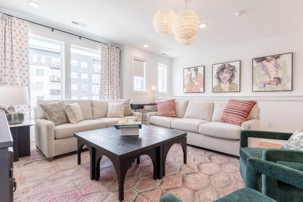 a living room with a couch and a table at Jocelyn at The Lucy by Stay Local Nashville in Nashville