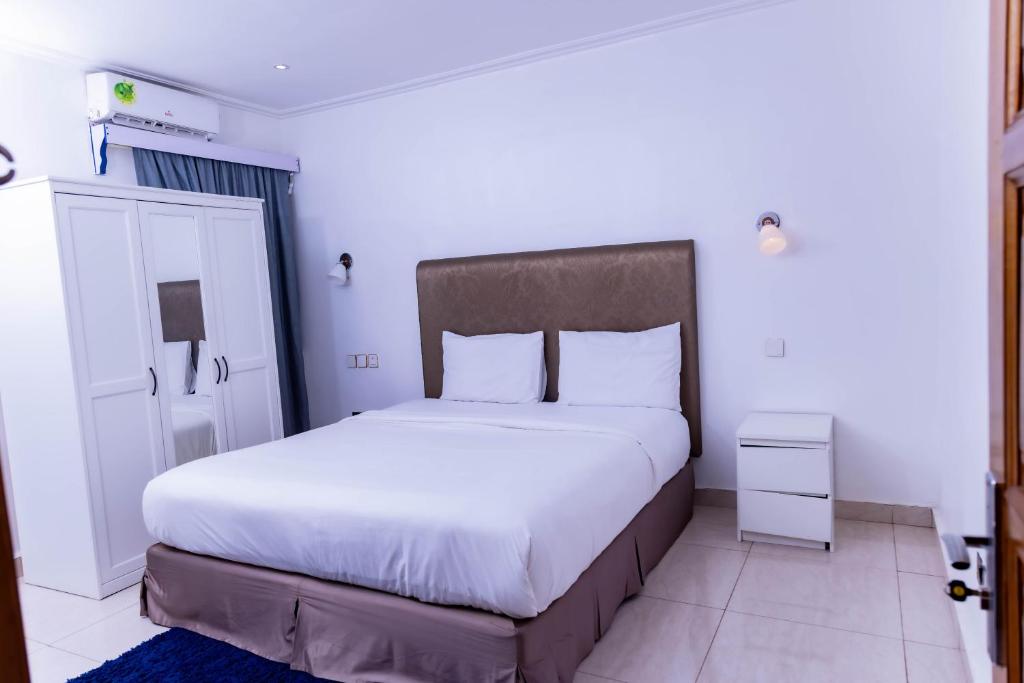 Postel nebo postele na pokoji v ubytování Pinorich Hotel
