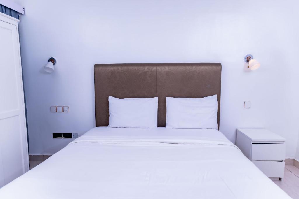 Postel nebo postele na pokoji v ubytování Pinorich Hotel