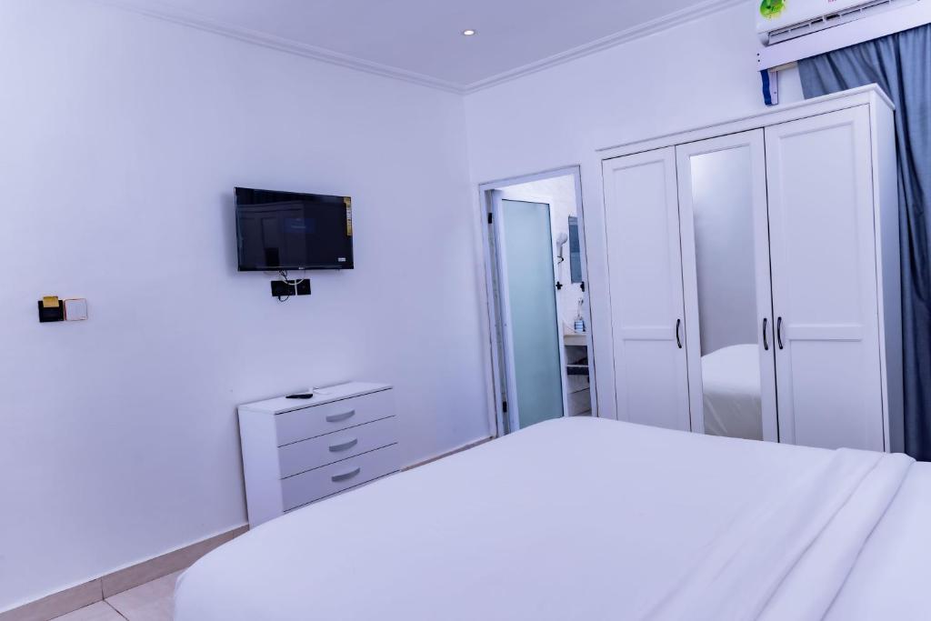 Postel nebo postele na pokoji v ubytování Pinorich Hotel