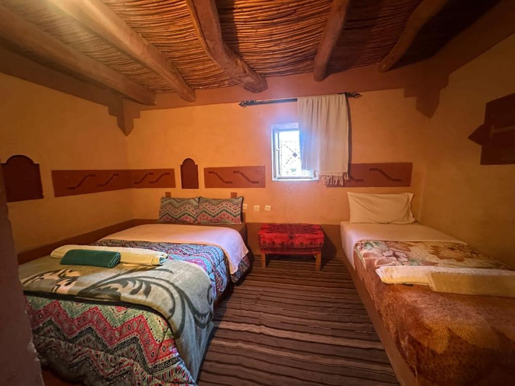 Postel nebo postele na pokoji v ubytování Gorges View Dades