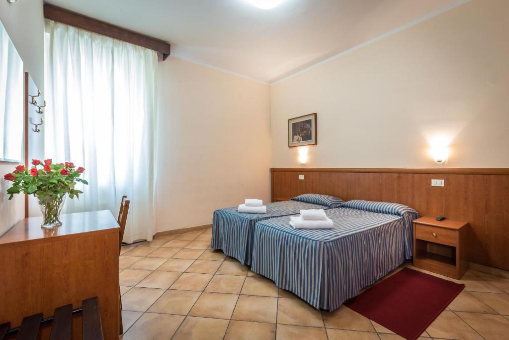 Postel nebo postele na pokoji v ubytování Hotel Real