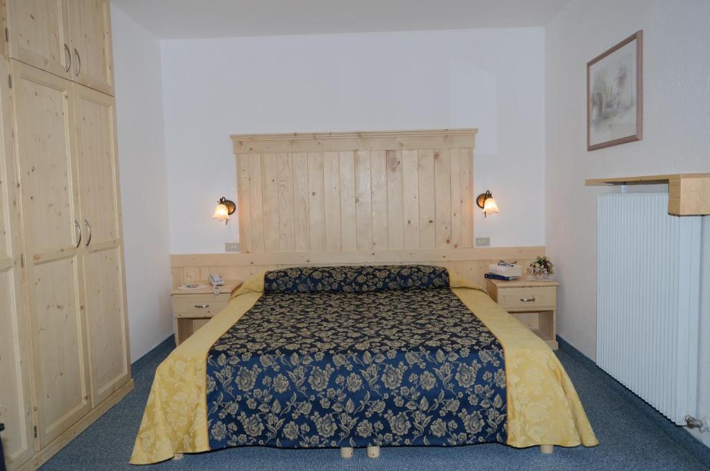 Postel nebo postele na pokoji v ubytování Hotel Corona