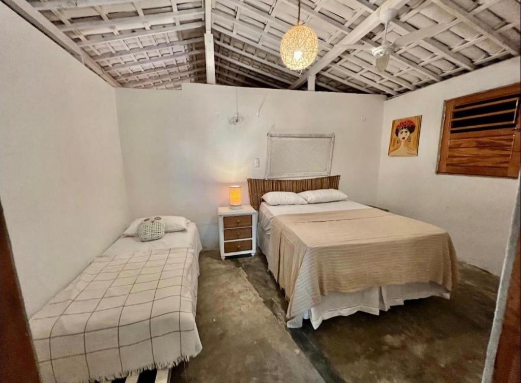 Postel nebo postele na pokoji v ubytování Casa Sereia Icapuí