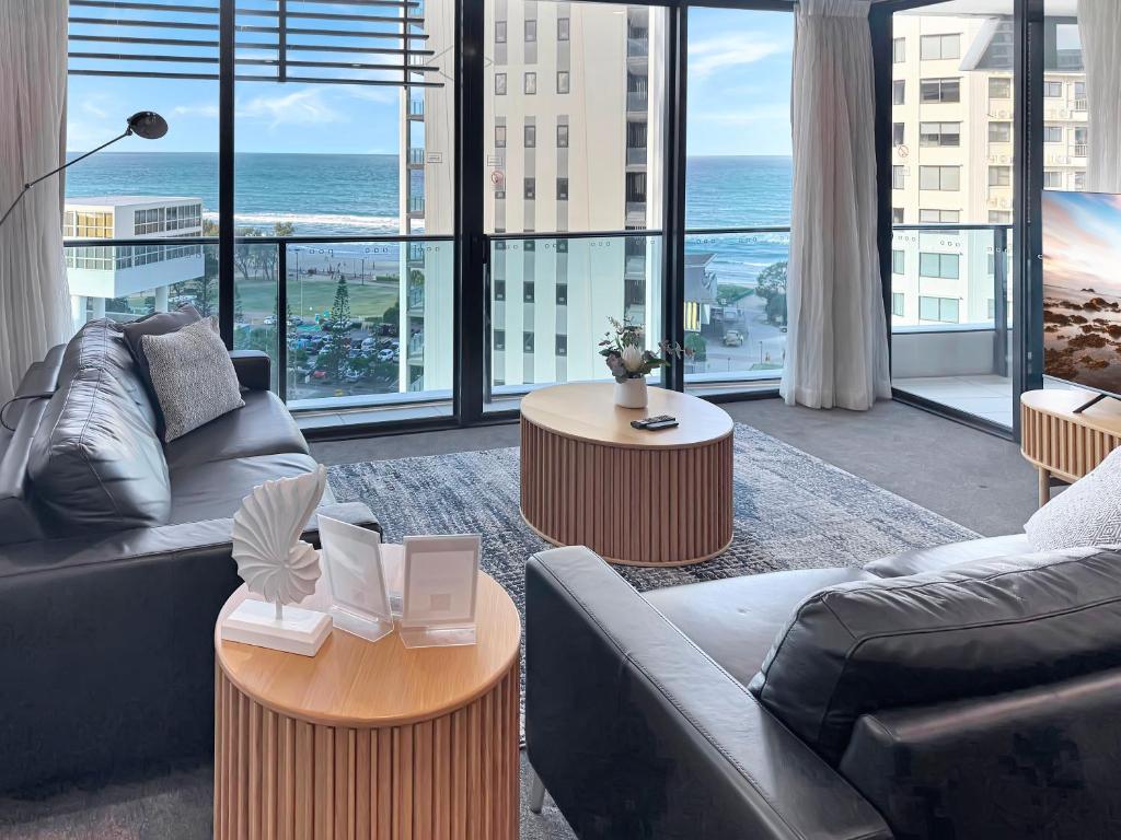 a living room with a view of the ocean at Oracle 11th floor Tower 1 - GC Getaways in Gold Coast