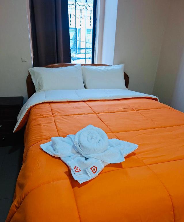 Postel nebo postele na pokoji v ubytování Travel Hotel Quito