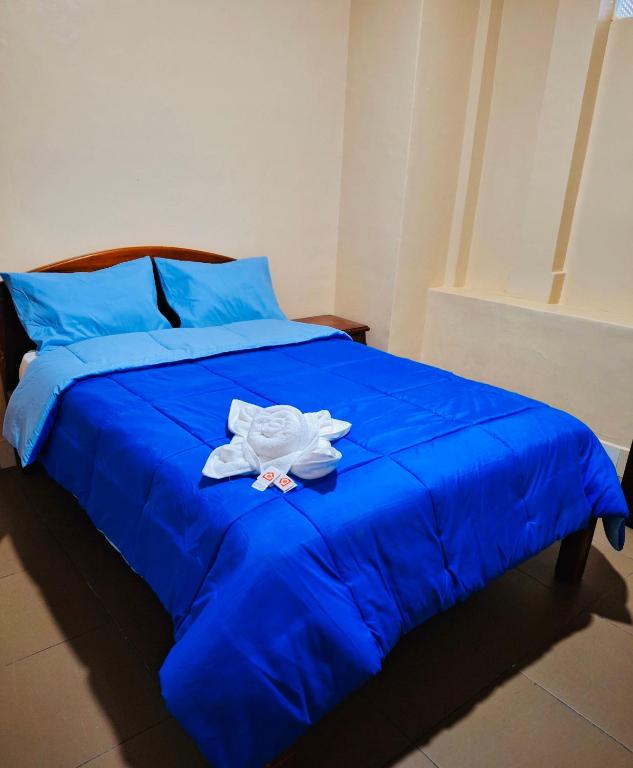 Postel nebo postele na pokoji v ubytování Travel Hotel Quito