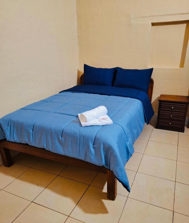 Postel nebo postele na pokoji v ubytování Travel Hotel Quito
