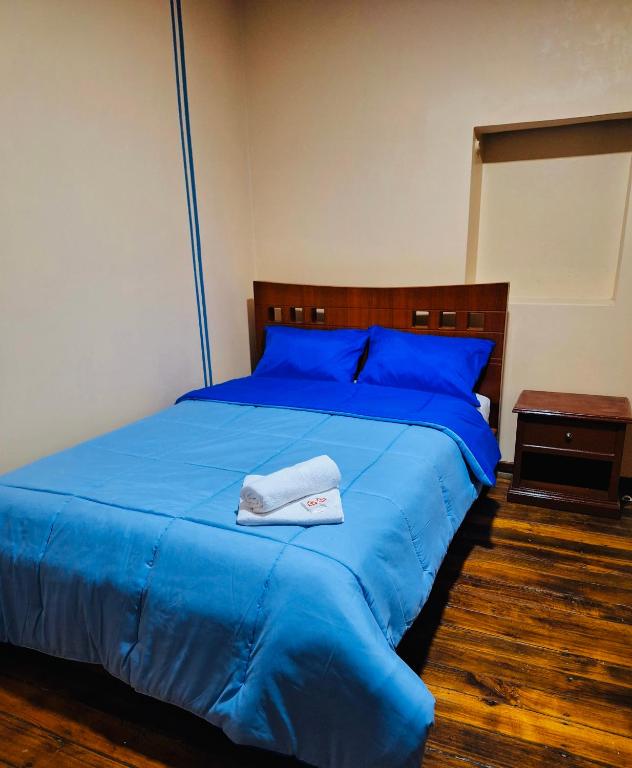 Postel nebo postele na pokoji v ubytování Travel Hotel Quito